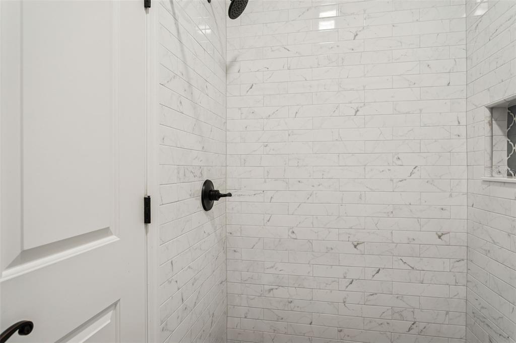 11606 Lipsey Road Tampa, FL 33618 - Photo 62 of 100 a bathroom with a shower