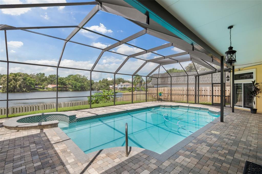 11606 Lipsey Road Tampa, FL 33618 - Photo 66 of 100 a view of a swimming pool with a porch