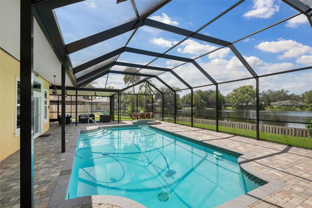 11606 Lipsey Road Tampa, FL 33618 - Photo 67 of 100 a view of a swimming pool with a patio