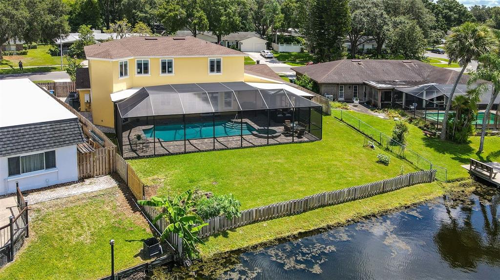 11606 Lipsey Road Tampa, FL 33618 - Photo 75 of 100 a view of a house with swimming pool garden and patio