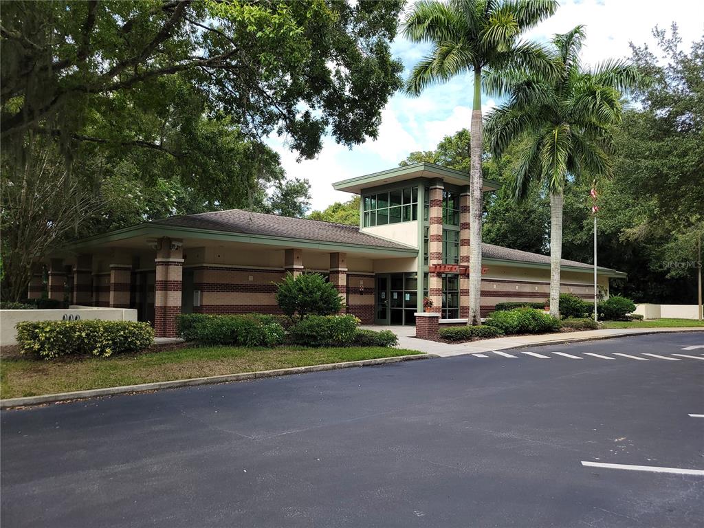 11606 Lipsey Road Tampa, FL 33618 - Photo 96 of 100 a front view of a house with a yard and garage
