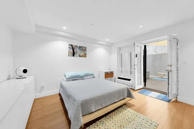 a bedroom with a bed and a walk in closet