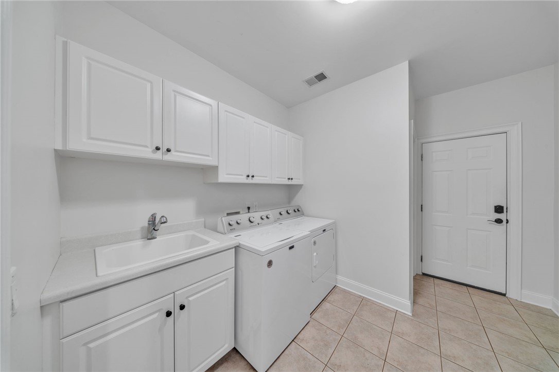 102 Country Walk Lane Clemson, SC 29631 - Photo 29 of 39 Ample cabinetry provides smart storage in this bright and functional laundry area.