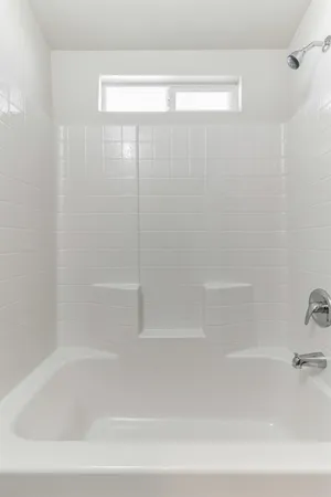 a close up of a bathtub in a bathroom