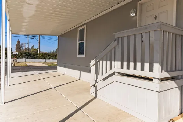 a view of a porch with wooden floor