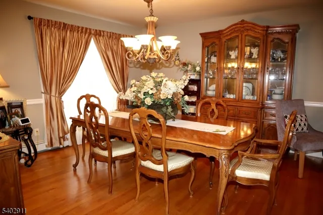 a dining room with furniture and window