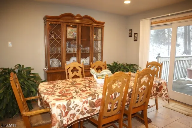a view of a dining room with furniture and a window