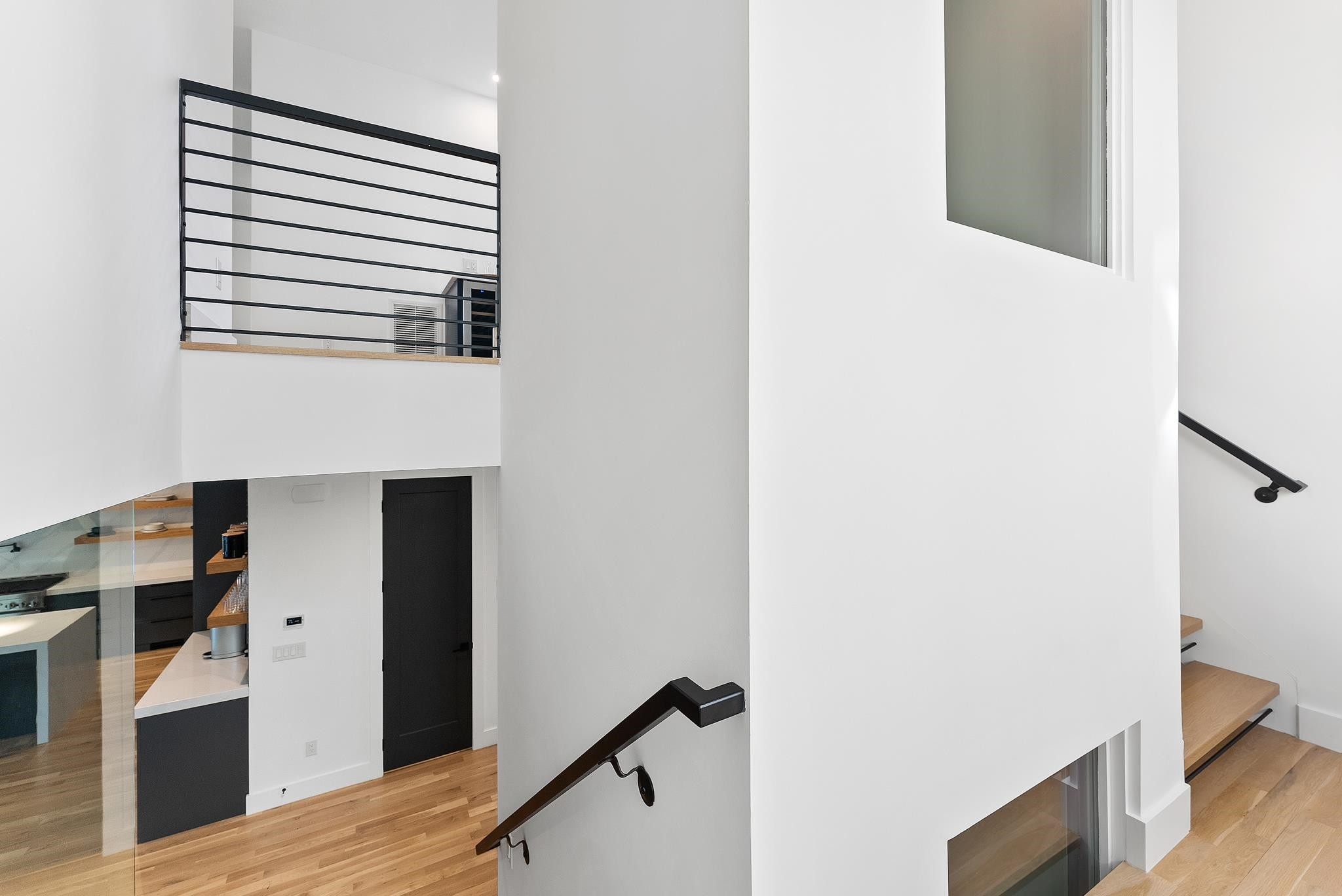 2511 Stafford Avenue Raleigh, NC 27607 - Photo 62 of 74 One of a kind - the custom stairway with open treads and steel wrap around the elevator, with windows Stair/Elevator