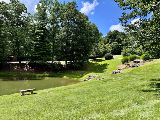 a view of a lake with a yard