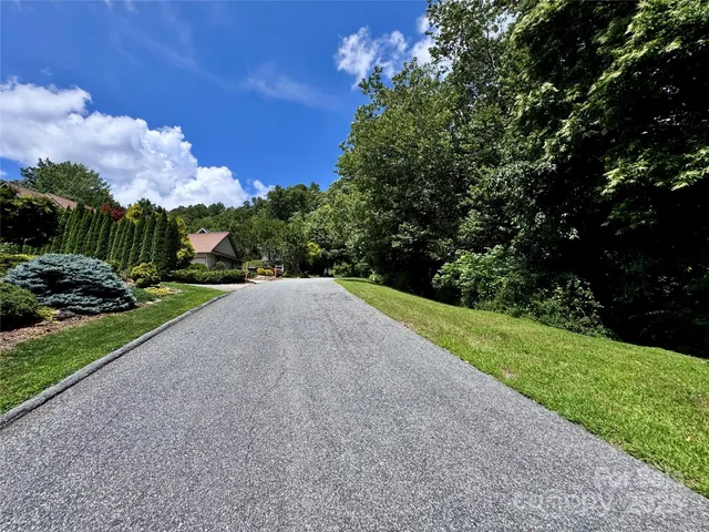 a view of a road with a yard