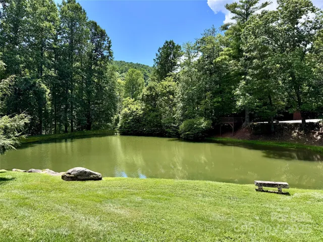 a view of a lake with a yard