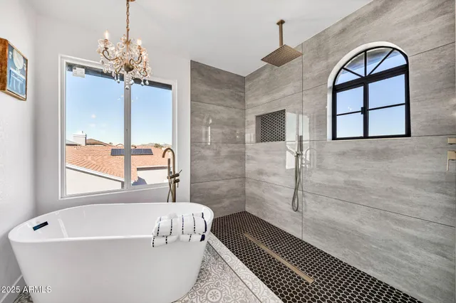 a view of an empty room with floor to ceiling window and potted plants