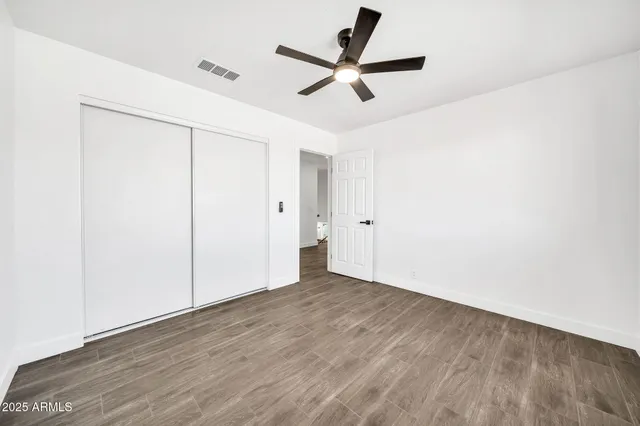 a front view of a house with a garden and plants