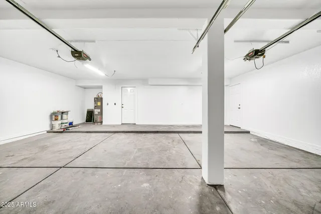 a view of an house with backyard and a garden