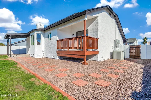 an aerial view of a house with swimming pool outdoor seating and yard