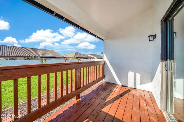 an aerial view of residential houses with outdoor space and parking