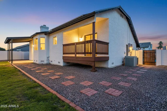 an aerial view of a house with a garden and plants