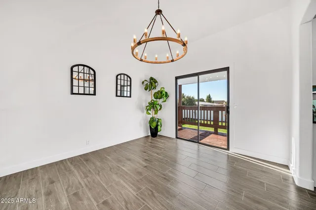 a view of an entryway with wooden floor