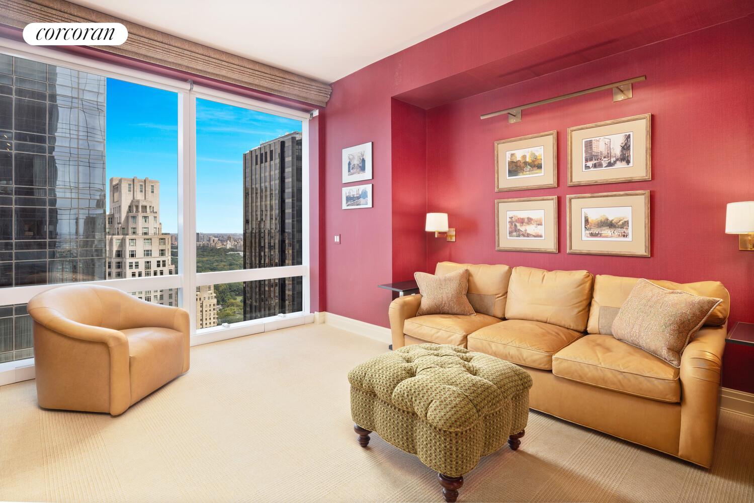 25 Columbus Circle, Unit 61G Manhattan, NY 10035 - Photo 10 of 23 a living room with furniture and a large window
