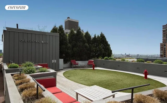 a terrace with outdoor seating and city view