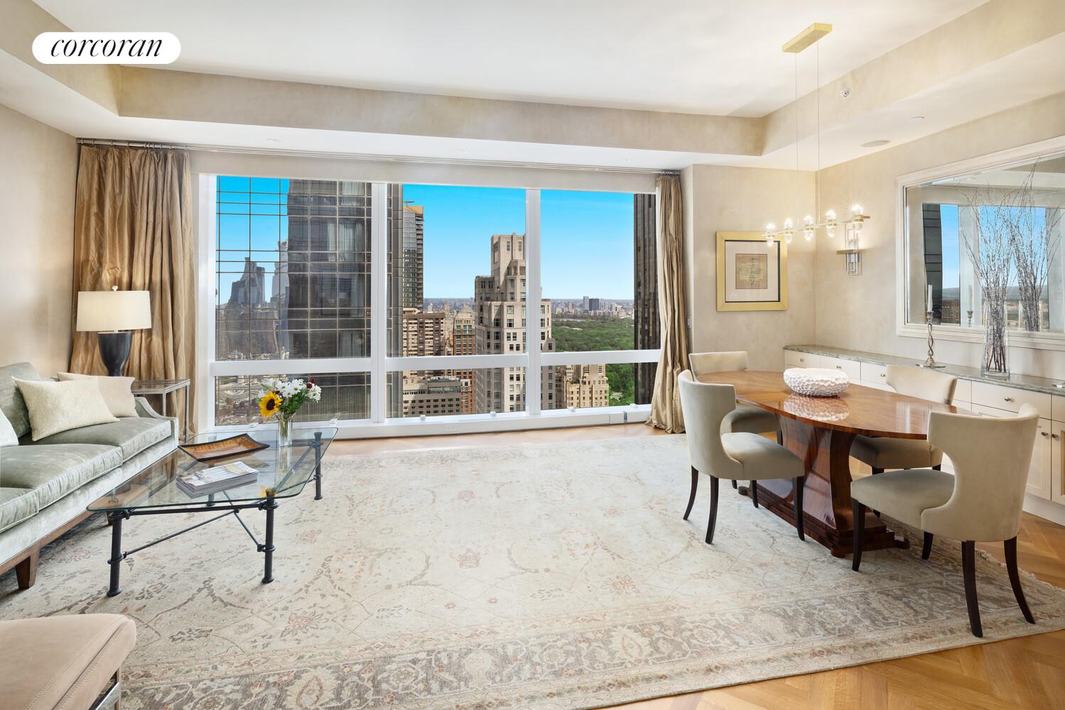 25 Columbus Circle, Unit 61G Manhattan, NY 10035 - Photo 4 of 23 a living room with furniture and a large window