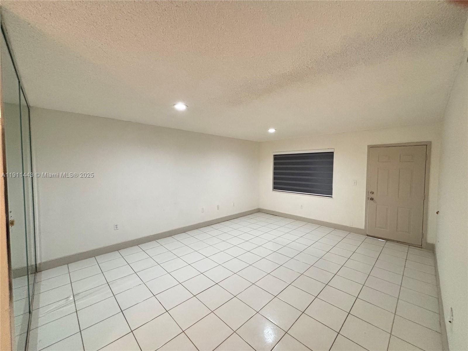 10350 Southwest 220th Street, Unit 251 Cutler Bay, FL 33190 - Photo 3 of 10 a view of an empty room