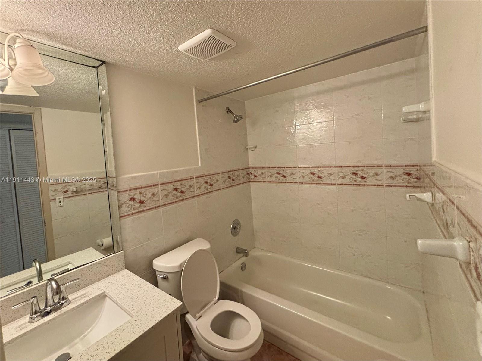 10350 Southwest 220th Street, Unit 251 Cutler Bay, FL 33190 - Photo 6 of 10 a bathroom with a sink toilet and shower