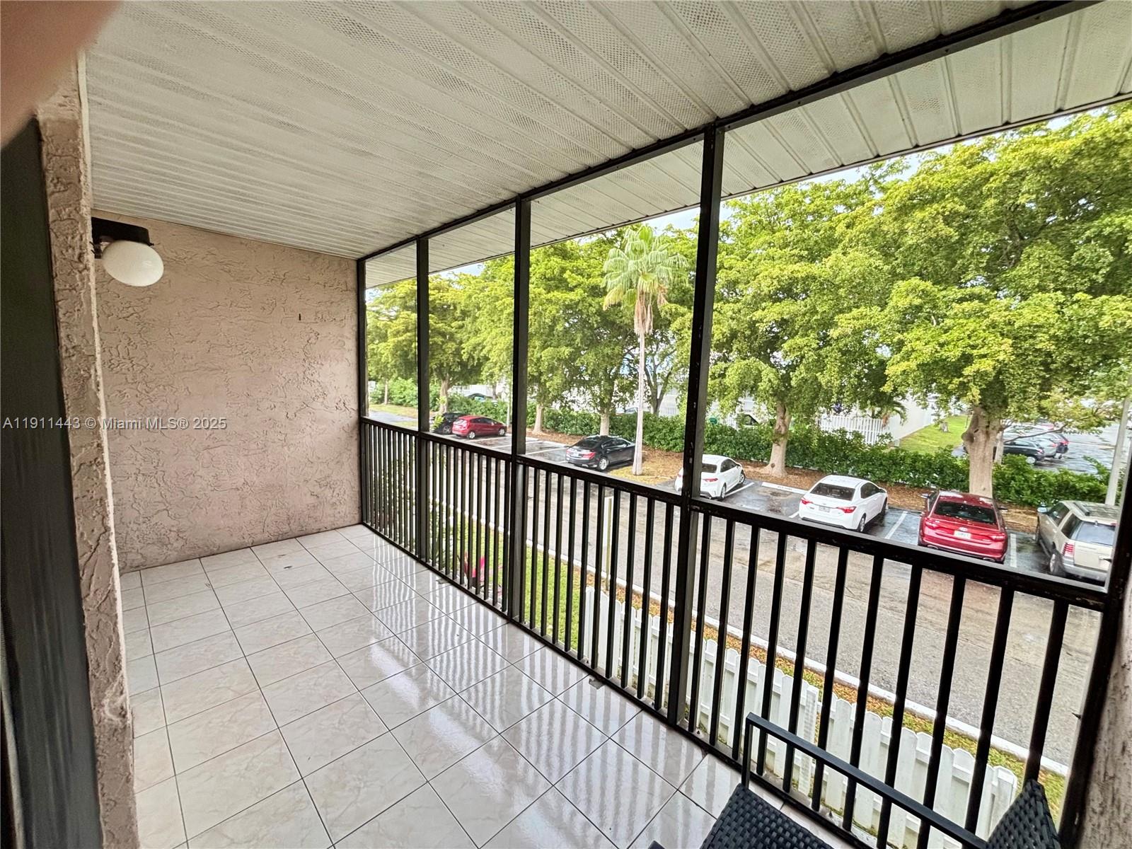 10350 Southwest 220th Street, Unit 251 Cutler Bay, FL 33190 - Photo 8 of 10 a view of a porch