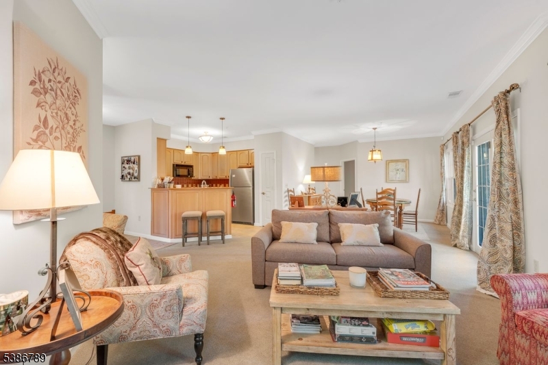 1 Maple Crescent, Unit 13 Vernon, NJ 07462 - Photo 22 of 29 a living room with furniture and a large window