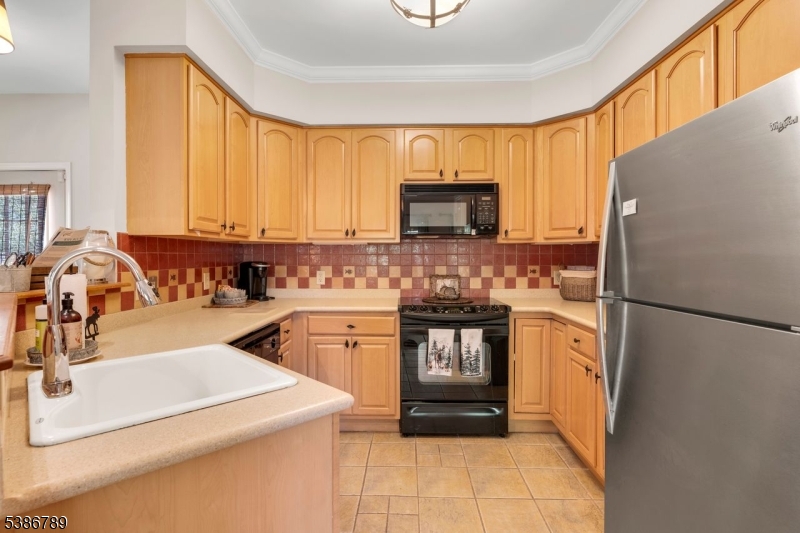 1 Maple Crescent, Unit 13 Vernon, NJ 07462 - Photo 23 of 29 a kitchen with a refrigerator sink and stove