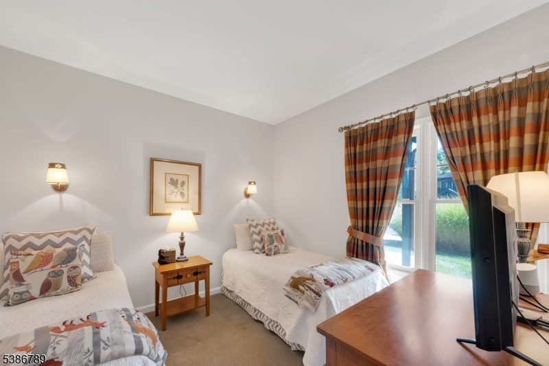 1 Maple Crescent, Unit 13 Vernon, NJ 07462 - Photo 10 of 29 a bedroom with a bed and a night stand