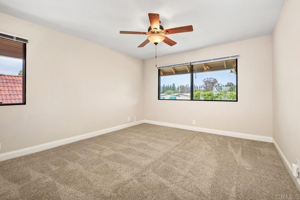 6 Cape Cod Irvine, CA 92620 - Photo 17 of 41 an empty room with window and ceiling fan