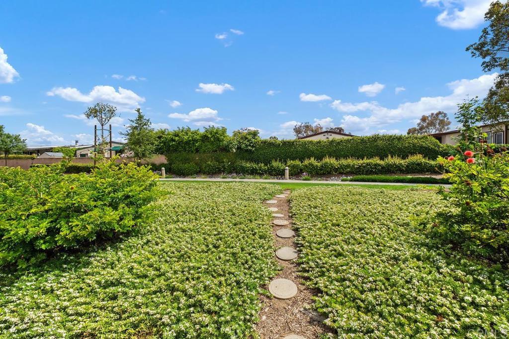 6 Cape Cod Irvine, CA 92620 - Photo 31 of 41 a view of a lake with a house in the background