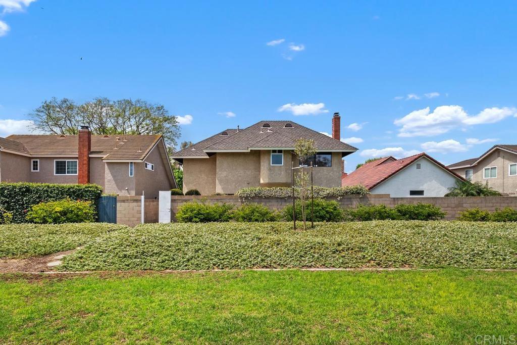 6 Cape Cod Irvine, CA 92620 - Photo 34 of 41 a front view of a house with a yard