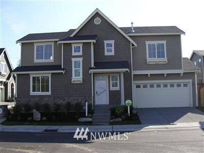 3906 183rd Place Southeast Bothell, WA 98012 - Photo 1 of 1 a front view of a house with garden