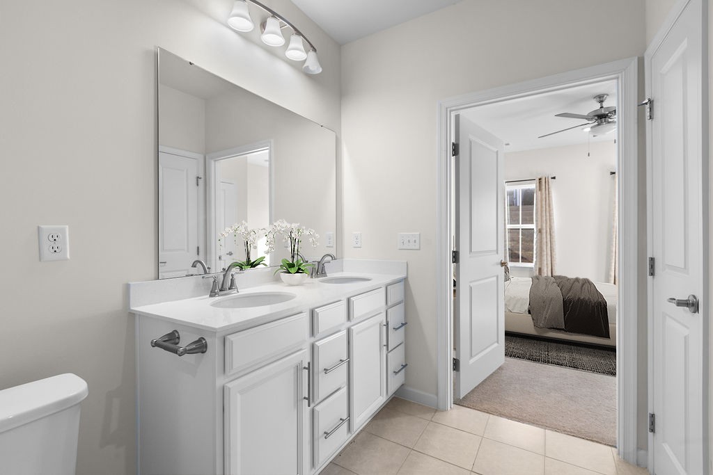 242 Marion Drive Spring Hill, TN 37174 - Photo 15 of 24 a bathroom with a sink a toilet and mirror