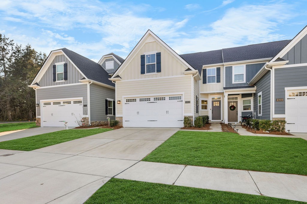 242 Marion Drive Spring Hill, TN 37174 - Photo 2 of 24 a front view of a house with a yard and garage