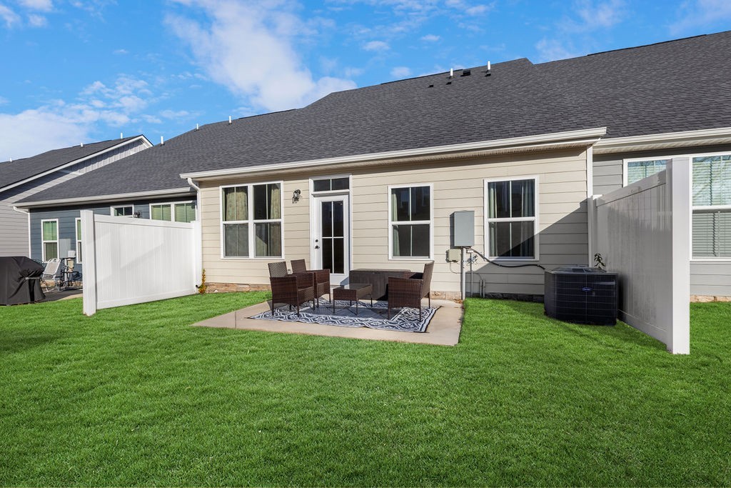 242 Marion Drive Spring Hill, TN 37174 - Photo 22 of 24 a view of a house with a yard and sitting area