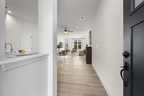 a view of a kitchen from the hallway