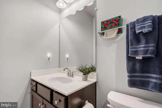 a living room with furniture a flat screen tv and a floor to ceiling window