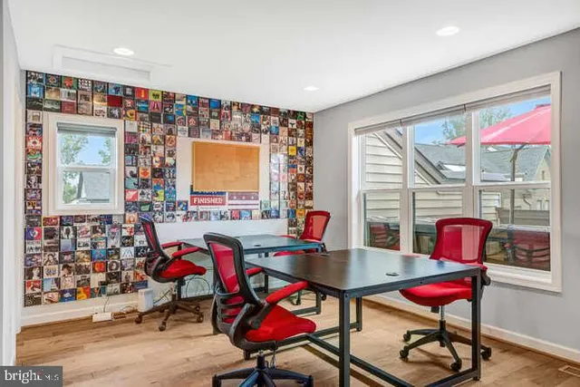 a view of a livingroom with furniture window and wooden floor