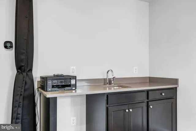 a bathroom with a sink toilet and a mirror