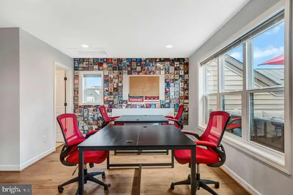 a view of sitting area with furniture and umbrella