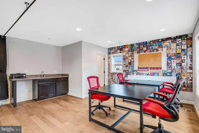 a view of a patio with a table and chairs under an umbrella