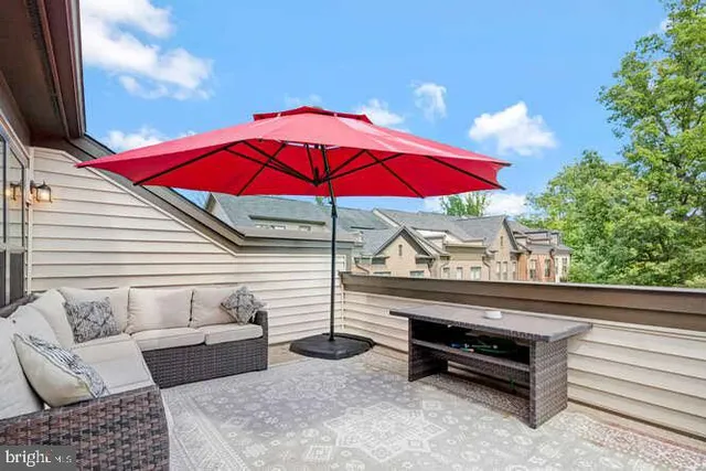 a view of a room with a table and chairs