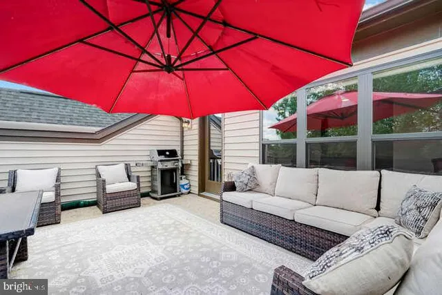 a view of a balcony with chairs and a table