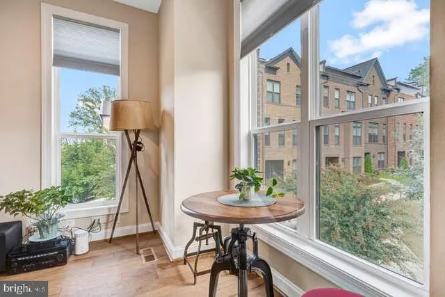 a kitchen with kitchen island granite countertop a sink and cabinets
