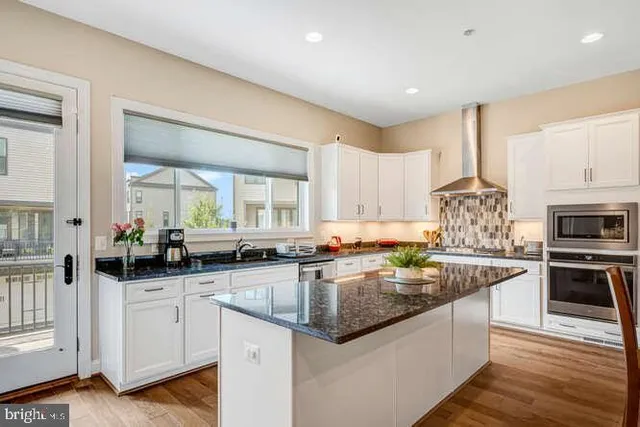 a view of a house with a wooden deck