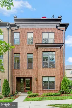 a bathroom with a sink toilet vanity and shower