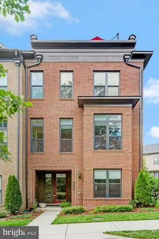 a bathroom with a sink toilet vanity and shower
